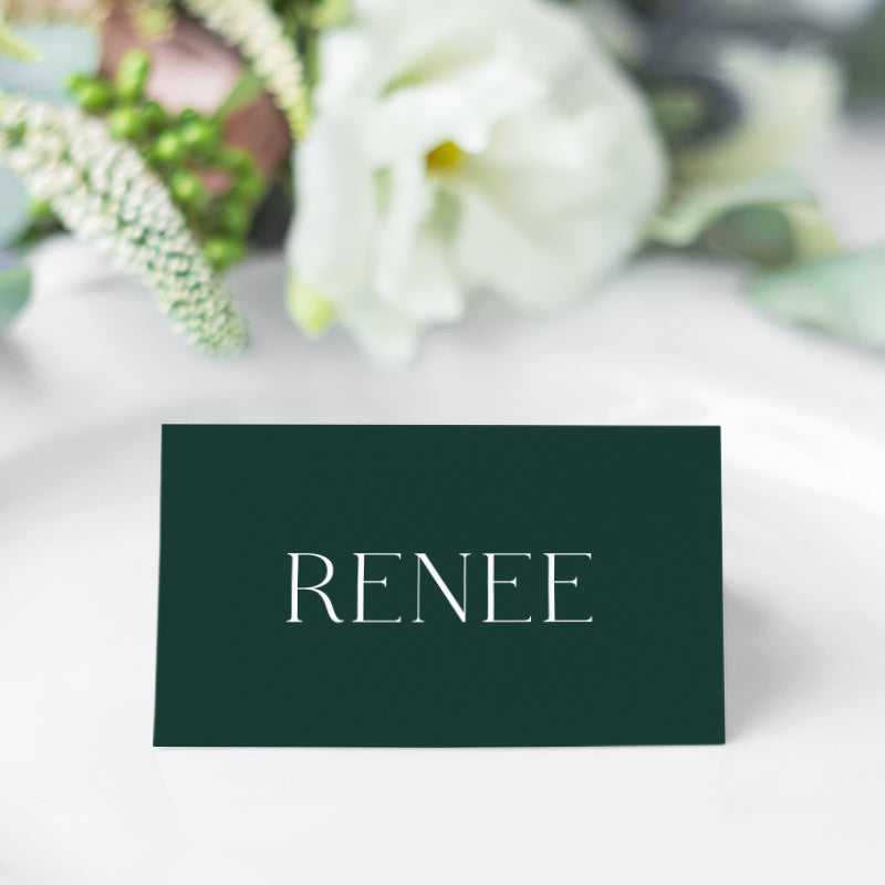 Minimal wedding place cards designed and printed in Australia. White ink on dark green card.