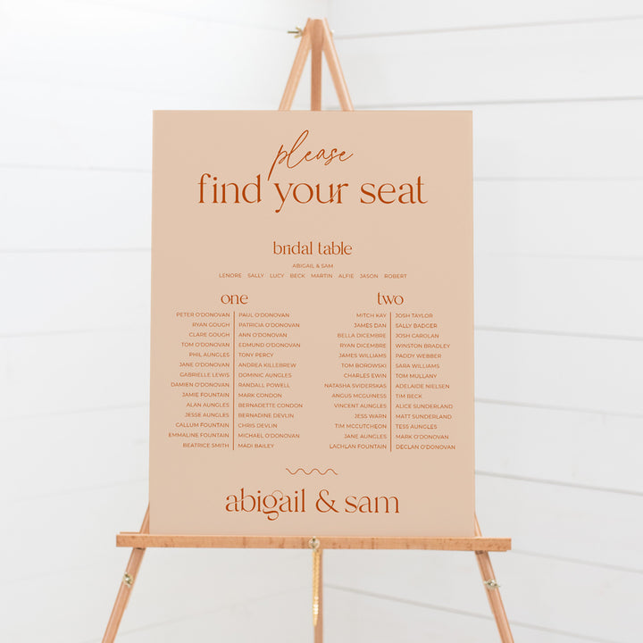 Modern retro wedding seating chart in peach or blush pink and burnt orange text. Designed and printed in Australia.