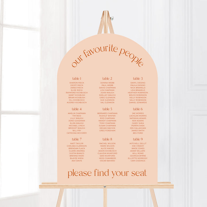 Modern arch retro wedding seating chart in peach or blush pink and burnt orange text. Designed and printed in Australia.