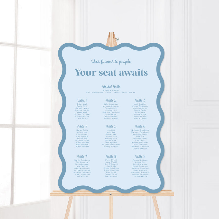 Modern wavy shape retro wedding seating chart in blue colours. Your seat awaits. Peach Perfect Australia.