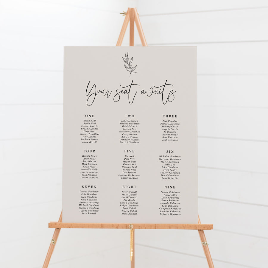 Wedding seating chart on foam board in neutral almond colour with hand drawn leaf element. Peach Perfect Australia.