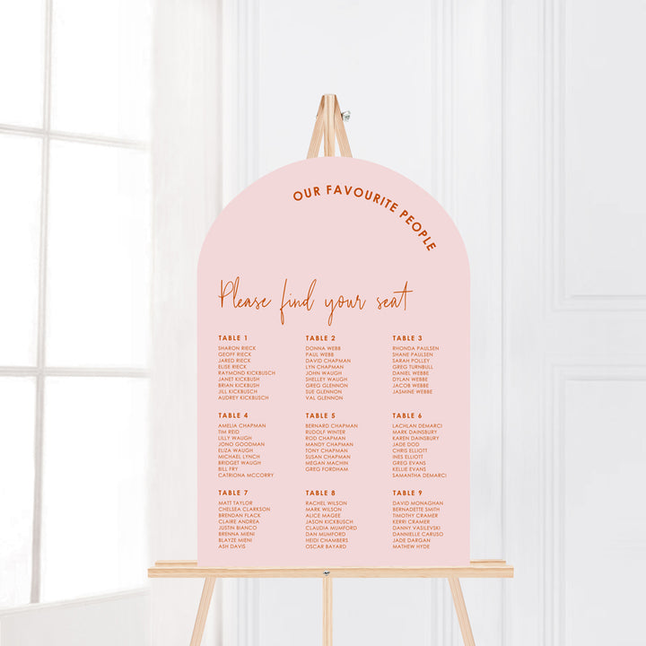 Modern arch wedding seating chart in soft pink and burnt orange. Designed and printed in Australia