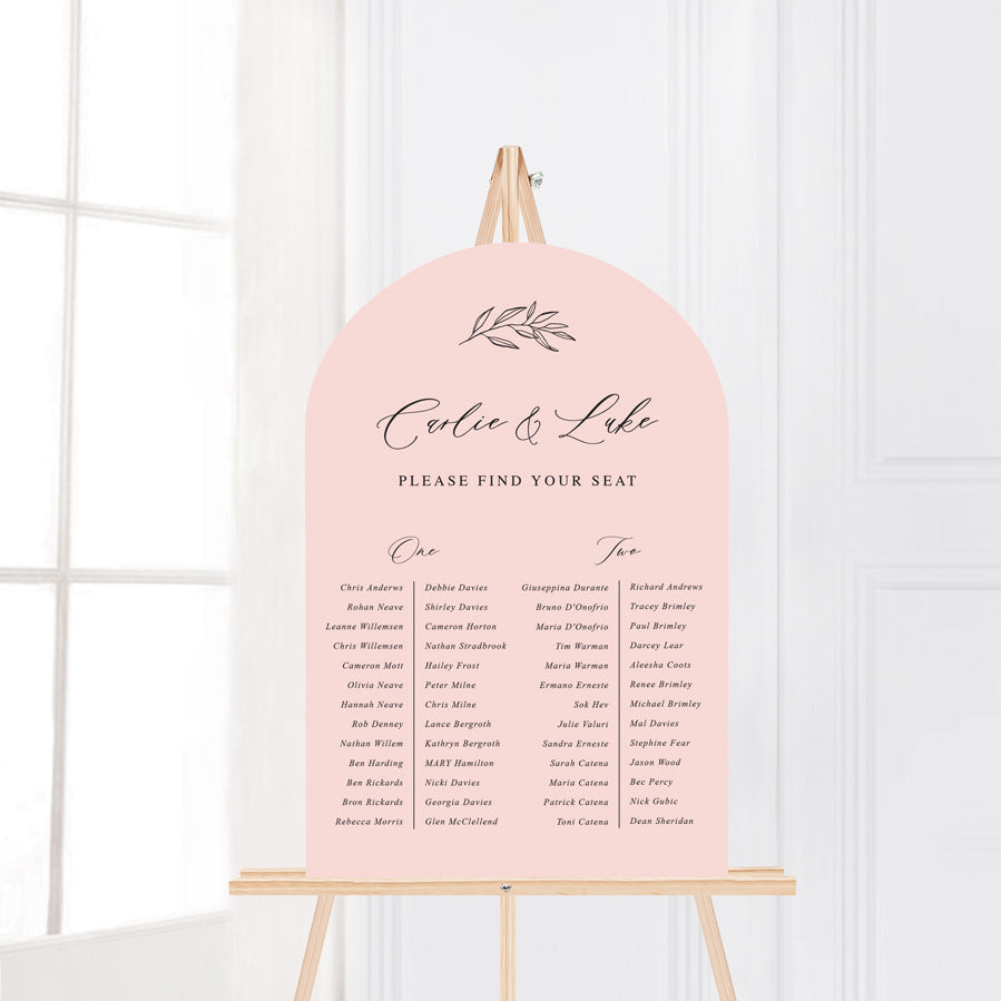 Arch wedding seating chart in soft pink with hand drawn leaf element and calligraphy. Peach Perfect Australia.