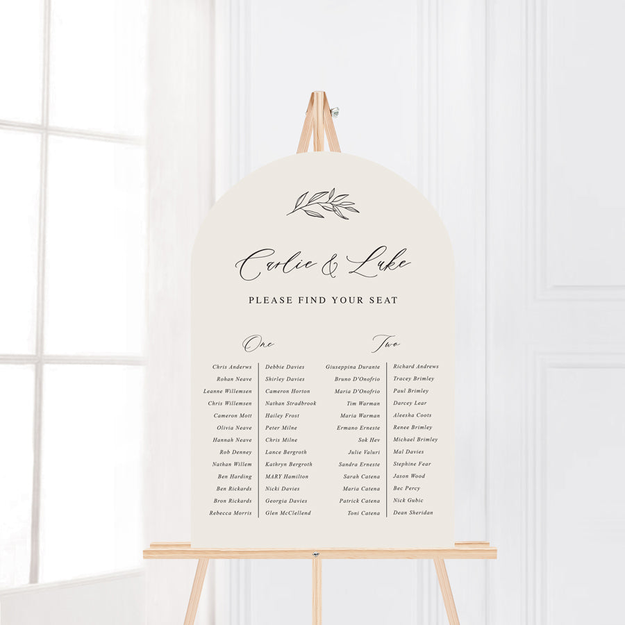 Arch wedding seating chart. Neutral almond background with hand drawn leaf element and calligraphy. Peach Perfect Australia.