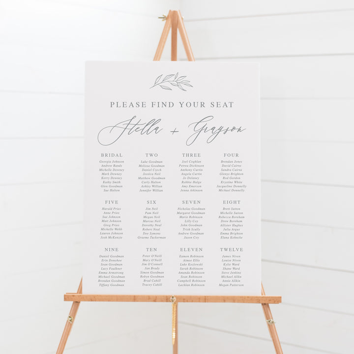 Beautiful wedding seating chart in grey and white with hand drawn leaf element and callilgraphy. Peach Perfect Australia.