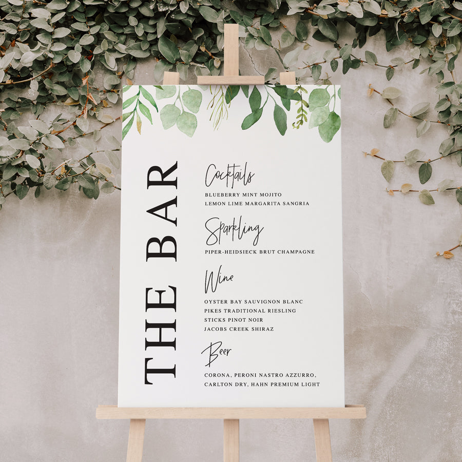 Wedding or corporate event bar sign sitting on easel with greenery and modern font styles. Designed and printed in Australia on premium board or acrylic.