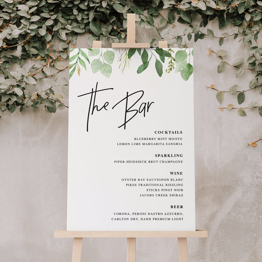 Wedding or corporate event bar sign sitting on easel with greenery and modern font styles. Designed and printed in Australia on premium board or acrylic.