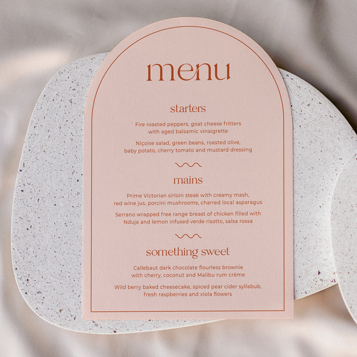 Retro arch wedding menu in blush pink or peach colour and orange. Designed and printed in Australia.
