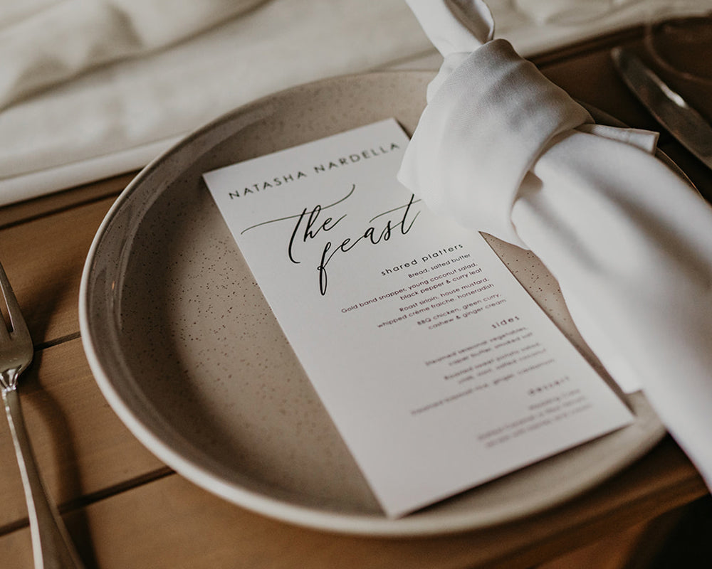 Beautiful black and white wedding menu with heading the feast
