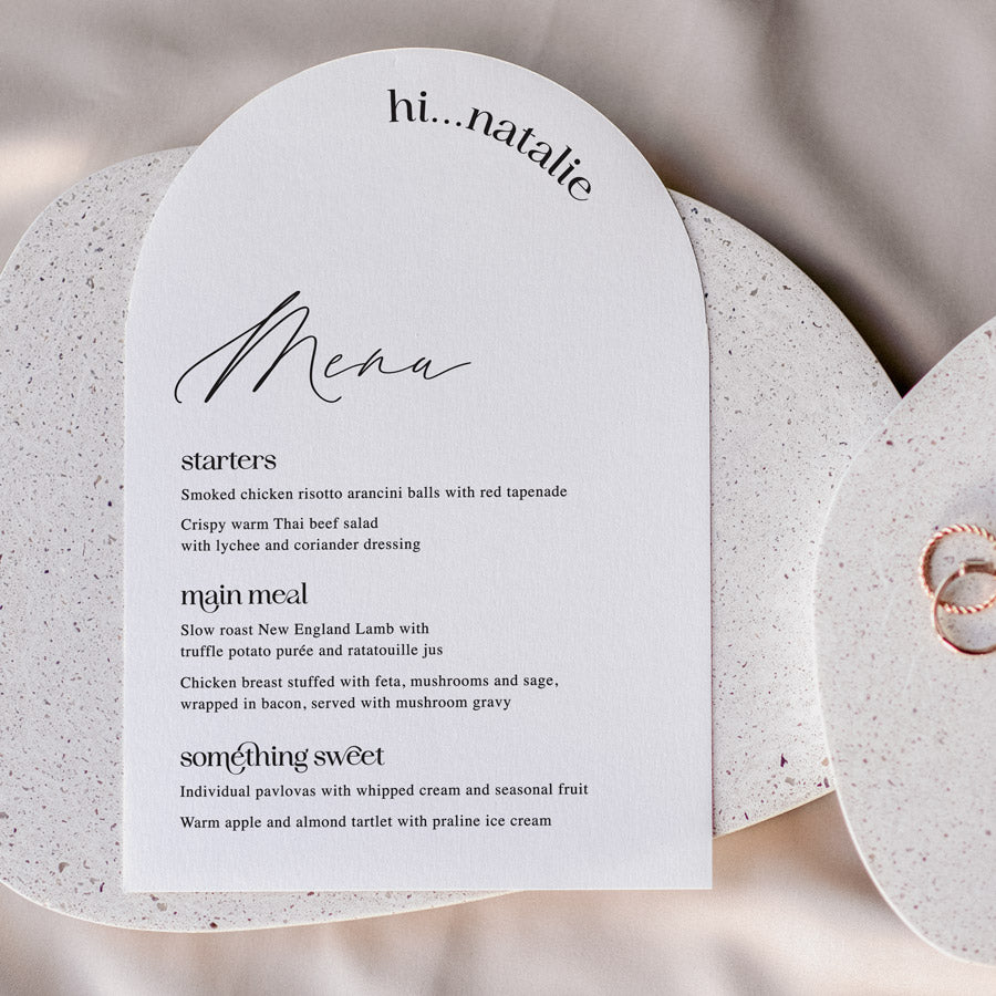 Modern wedding arch menu with trendy font styles in black and white and guest name printing. Peach Perfect Stationery Australia.