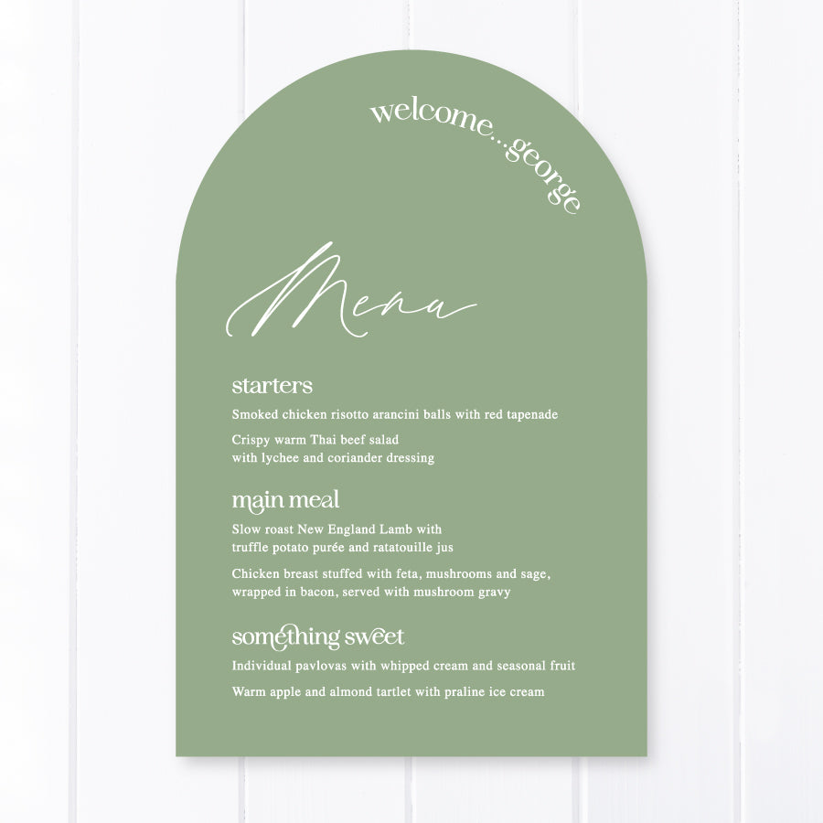 Modern arch wedding menu on green cardstock with white ink text and guest name printing. Peach Perfect Australia.