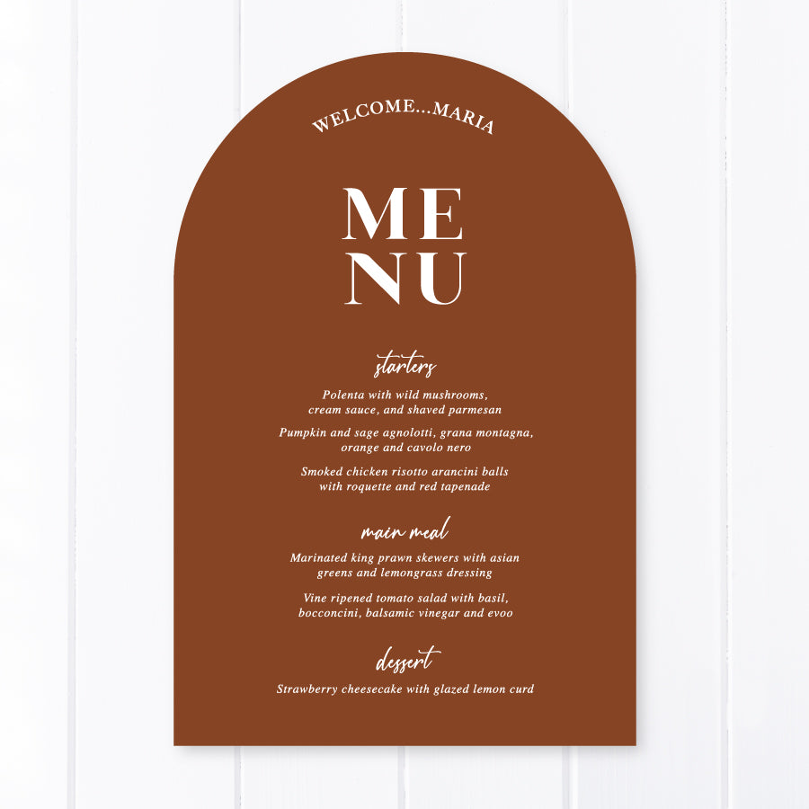 Modern arch wedding menu designed and printed in Australia with calligraphy font. Harvest terracotta cardstock with Lets Feast for heading.