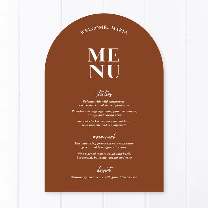 Modern arch wedding menu designed and printed in Australia with calligraphy font. Harvest terracotta cardstock with Lets Feast for heading.