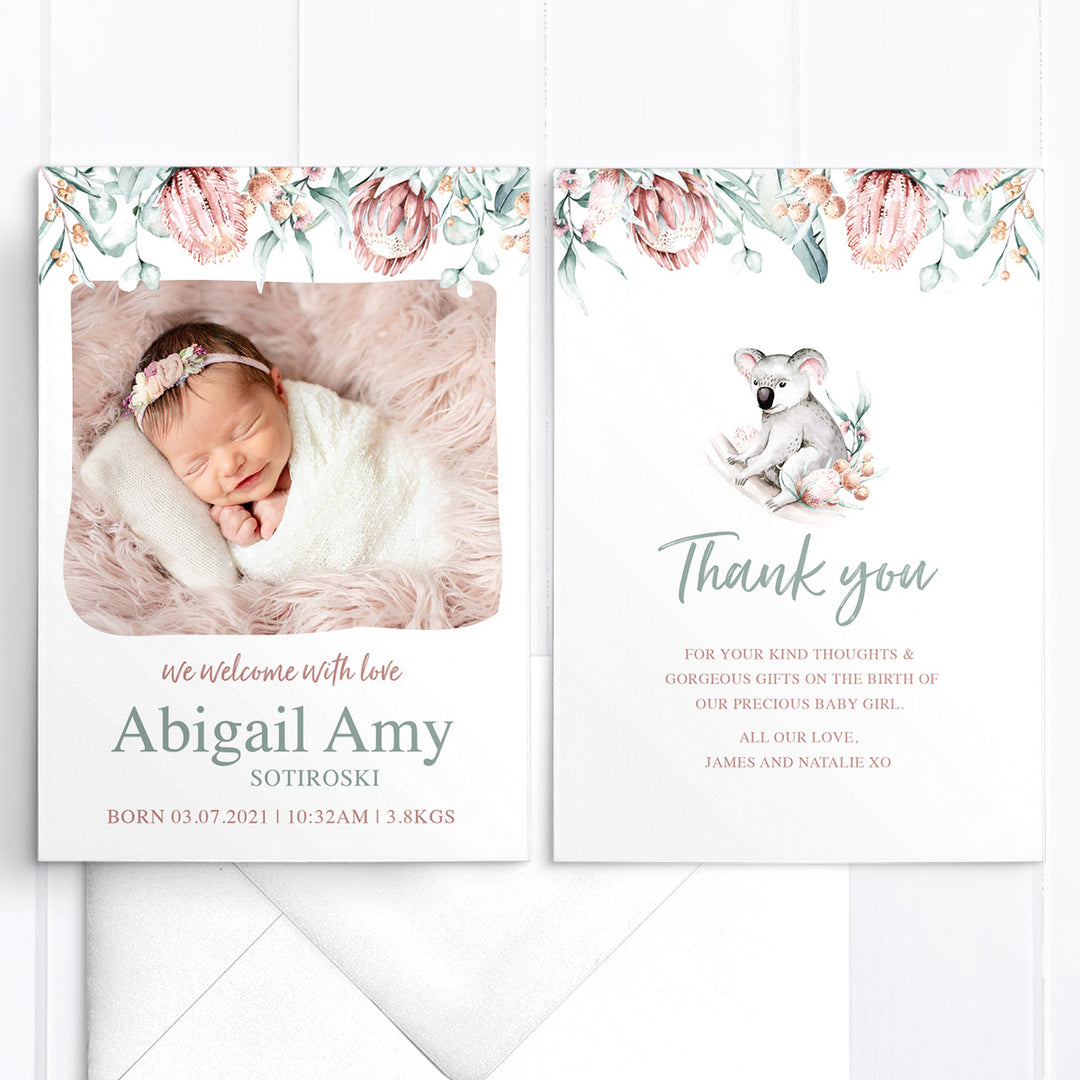 Baby girl birth announcement card with photo of baby and australian native flowers and greenery border