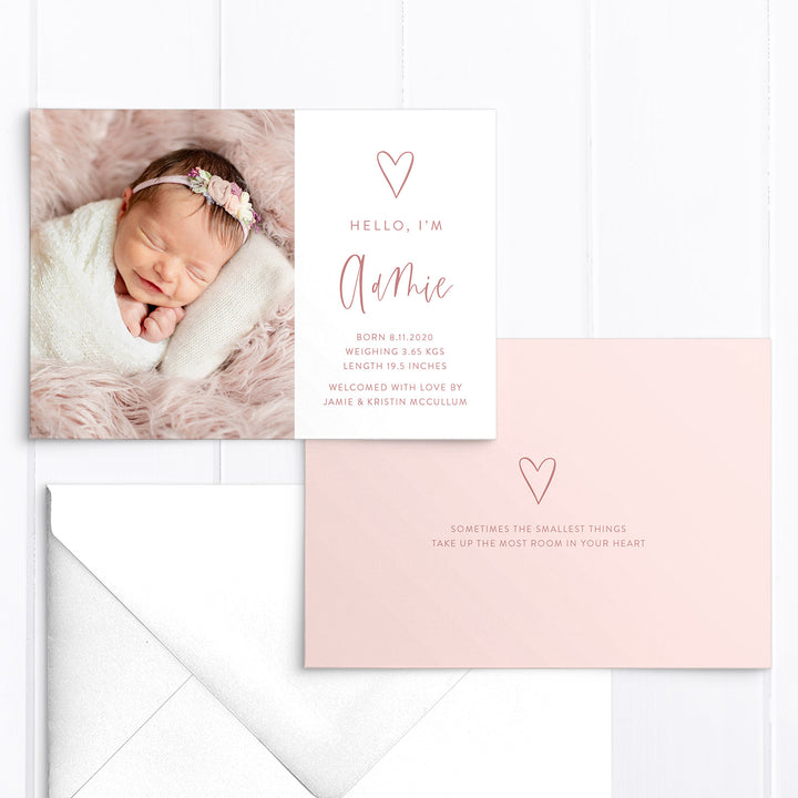 Modern baby girl photo birth announcement with large photo of baby and hand drawn love heart with birth details printed