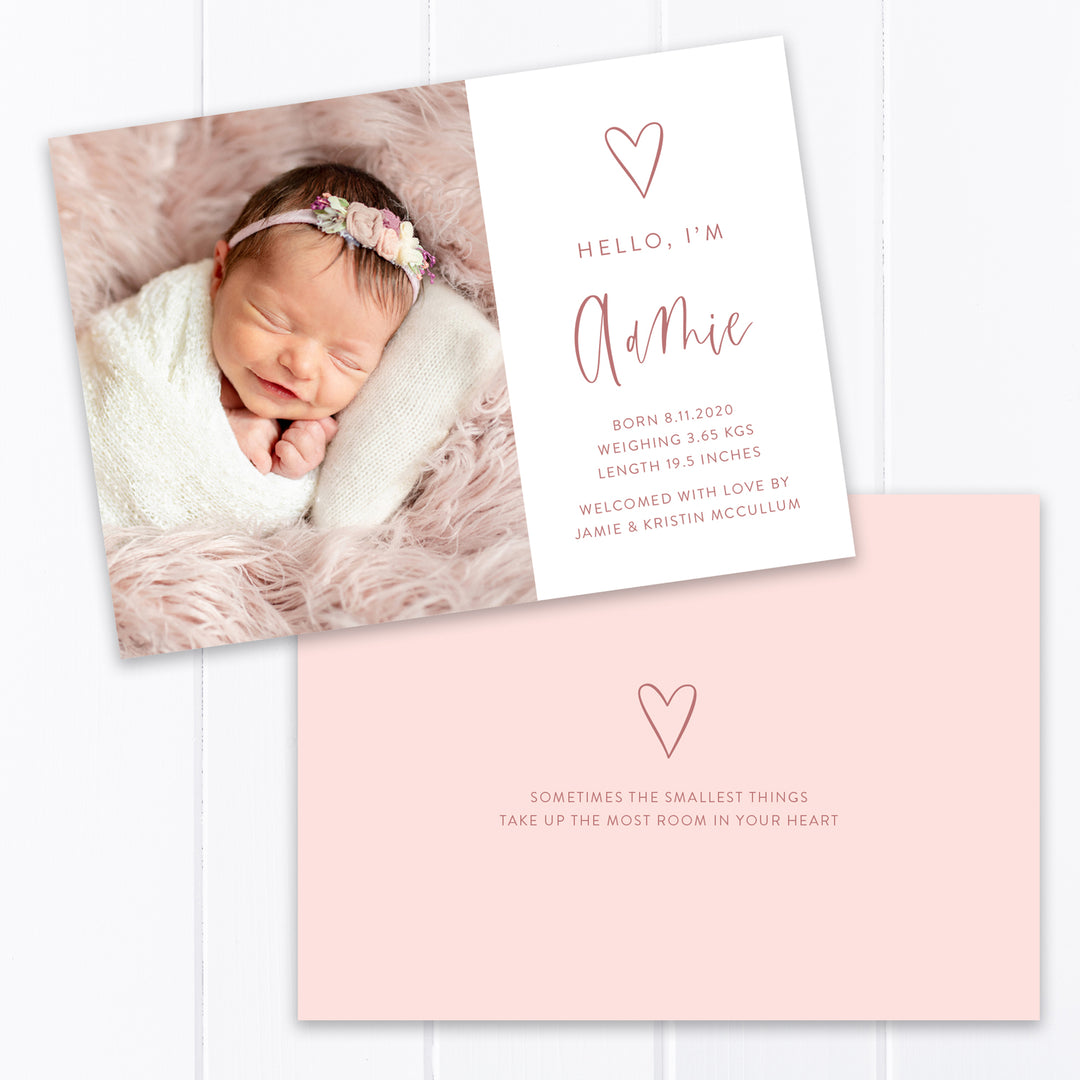 Modern baby girl photo birth announcement with large photo of baby and hand drawn love heart with birth details printed