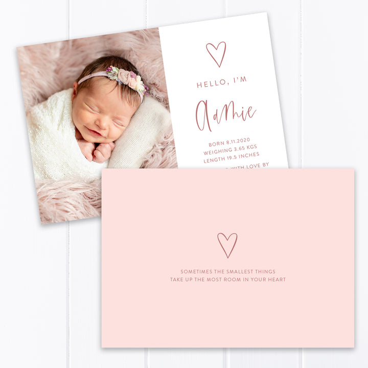 Modern baby girl photo birth announcement with large photo of baby and hand drawn love heart with birth details printed