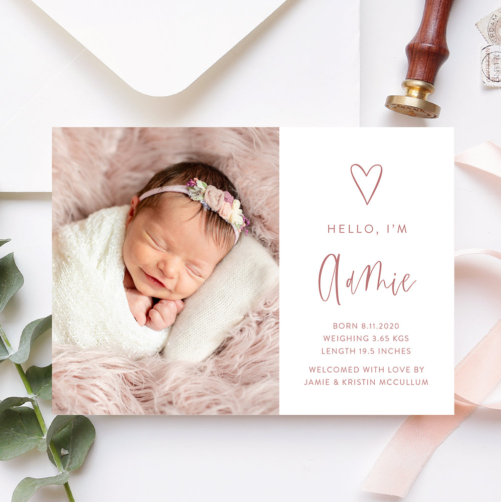 Modern baby girl photo birth announcement with large photo of baby and hand drawn love heart with birth details printed