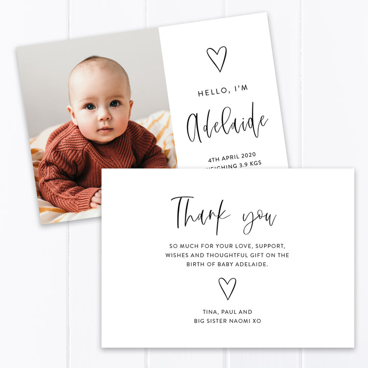 Modern photo baby birth announcement card for baby girl, hand drawn love heart and calligraphy font.