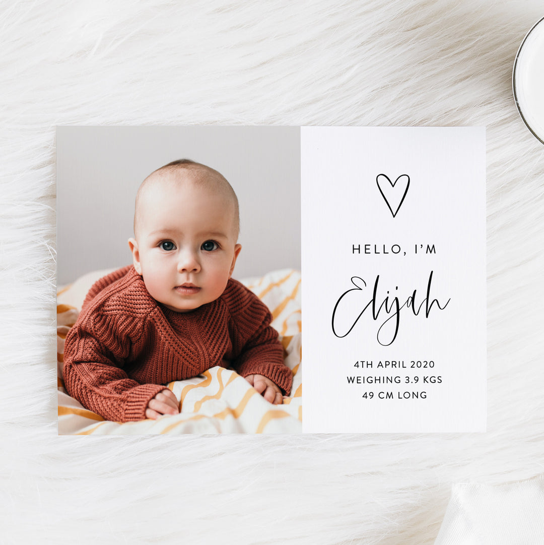 Baby boy photo birth announcement card with large photo of baby, hand drawn love heart and modern script font in black and white