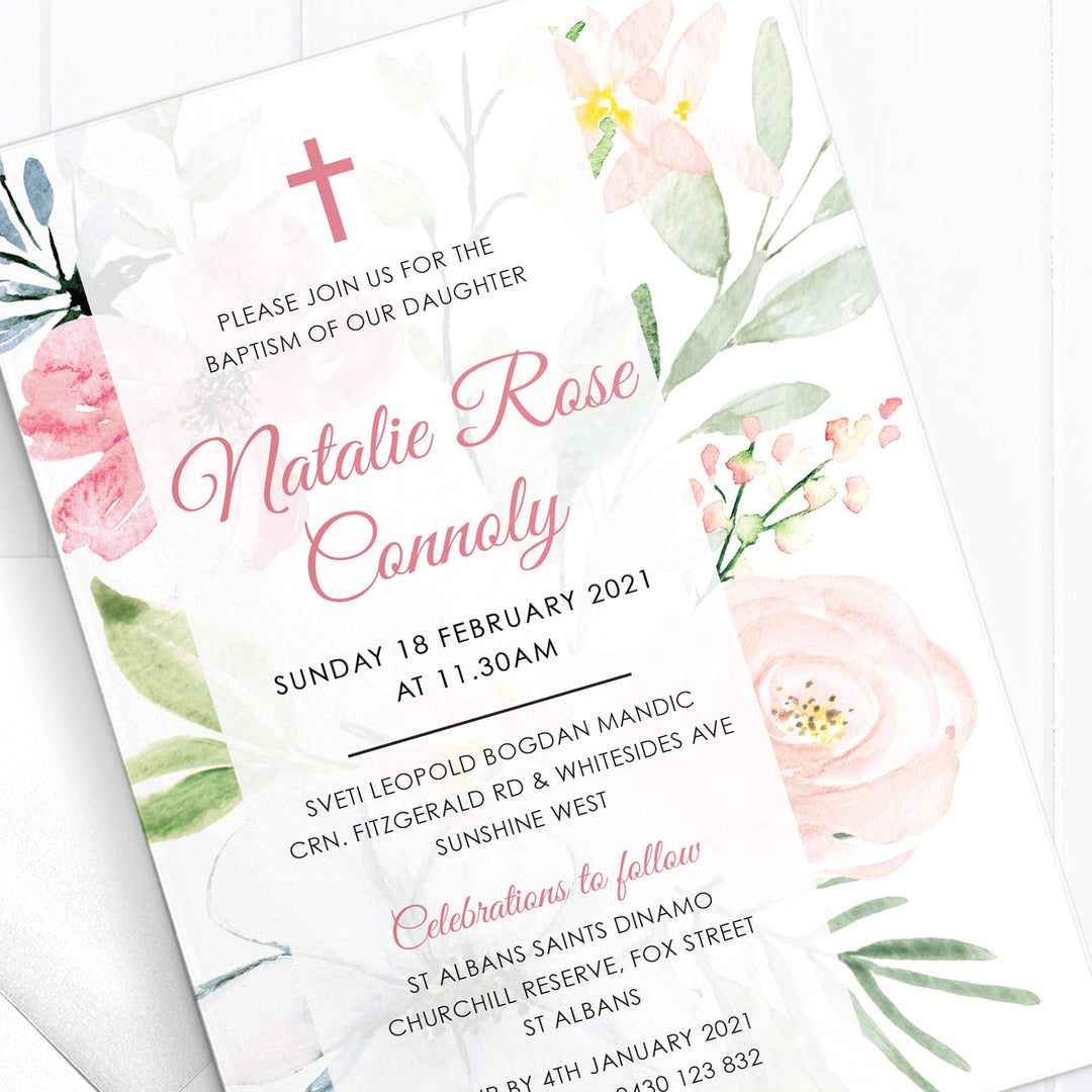 Beautiful baptism or christening invitation with soft pink and blue flowers and elegant calligraphy text and catholic cross in pink.