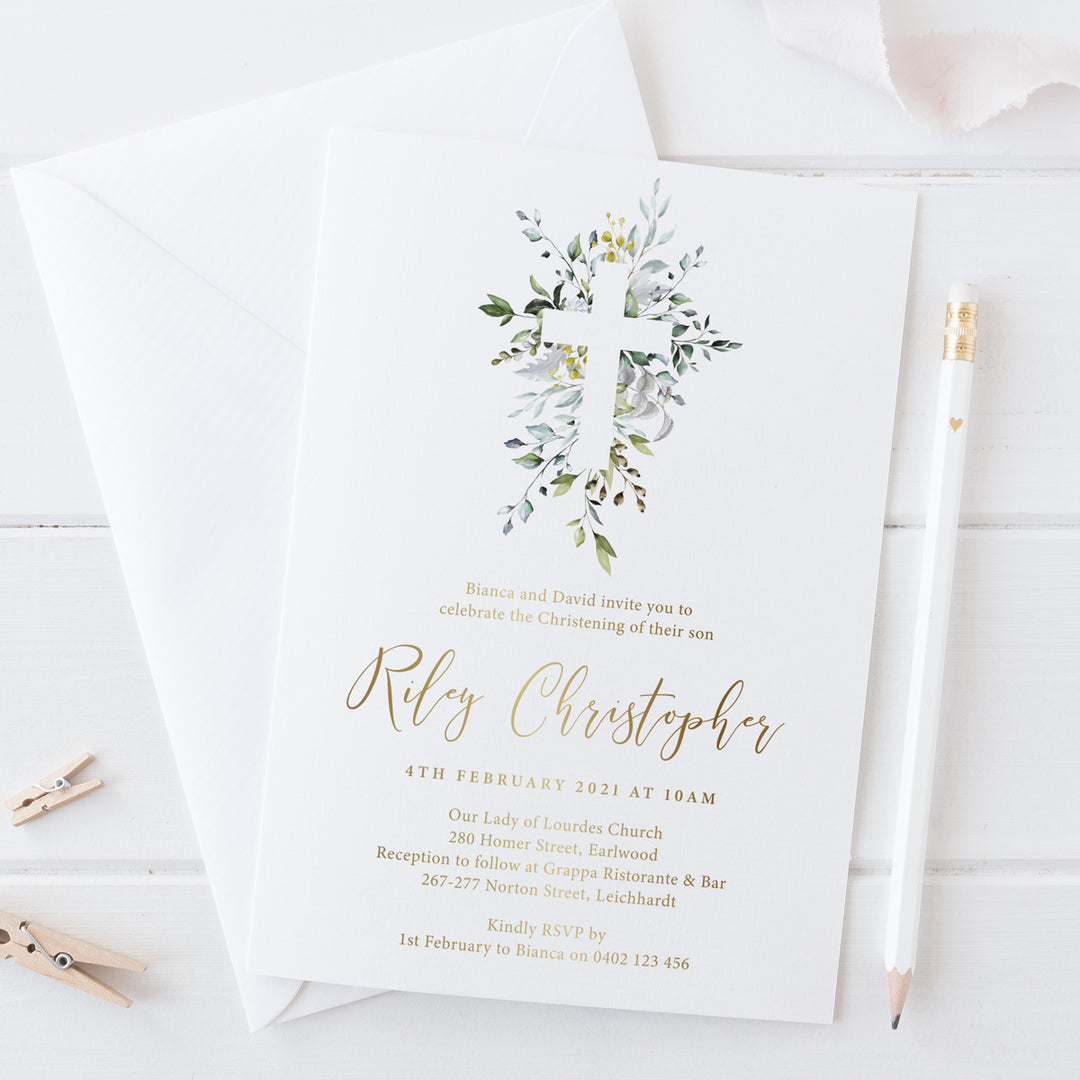 Baptism or Christening invitation with large cross surrounded by delicate green leaves and gold foil text. Ships to Australia and New Zealand.