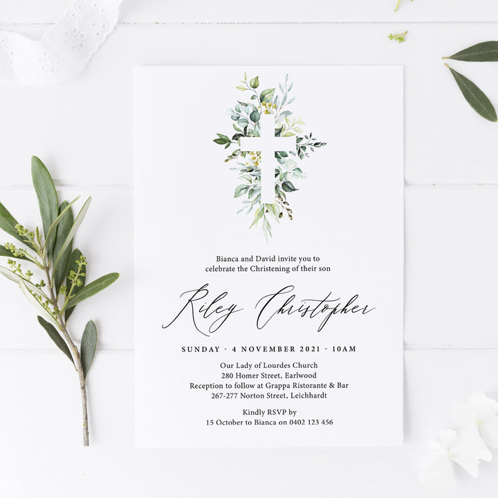 Boy Baptism and Christening invitation with beautiful detailed greenery cross and calligraphy for the name in black ink.