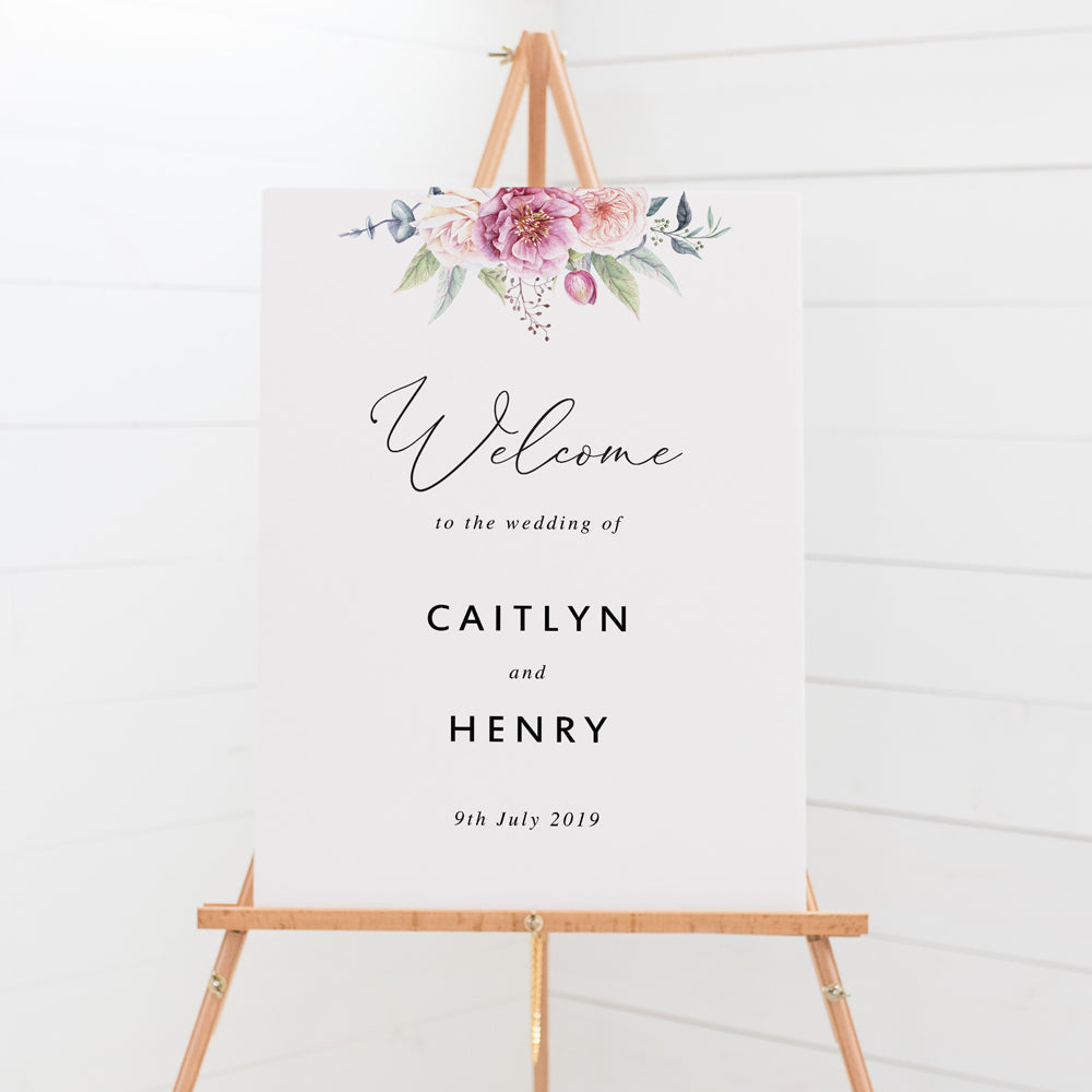 Wedding welcome sign board with calligraphy font and beautiful soft pink florals and greenery at the top, printed in Australia .