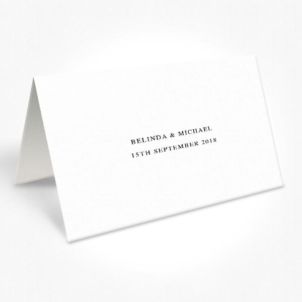 Black and white folded wedding place cards with calligraphy font 