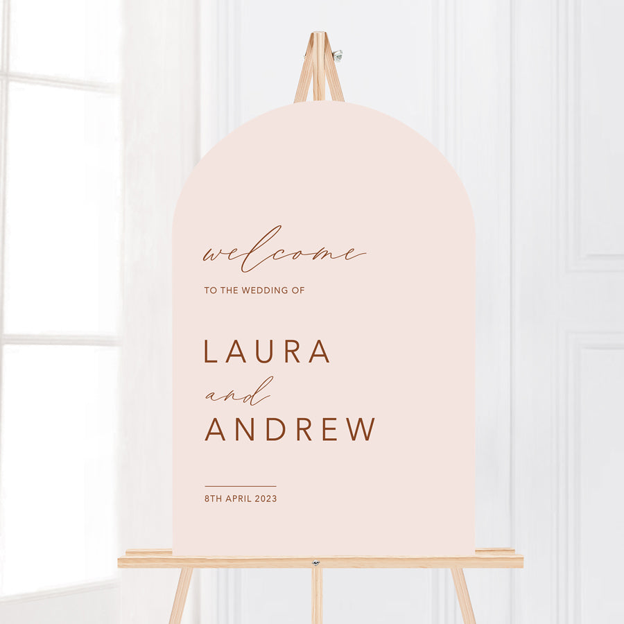 Bohemian arch wedding welcome sign in blush and terracotta. Printed in Australia on smooth board for sitting on an easel.