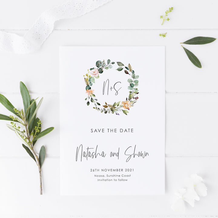 Boho wedding save the date with modern script font and watercolour floral wreath in natural colours