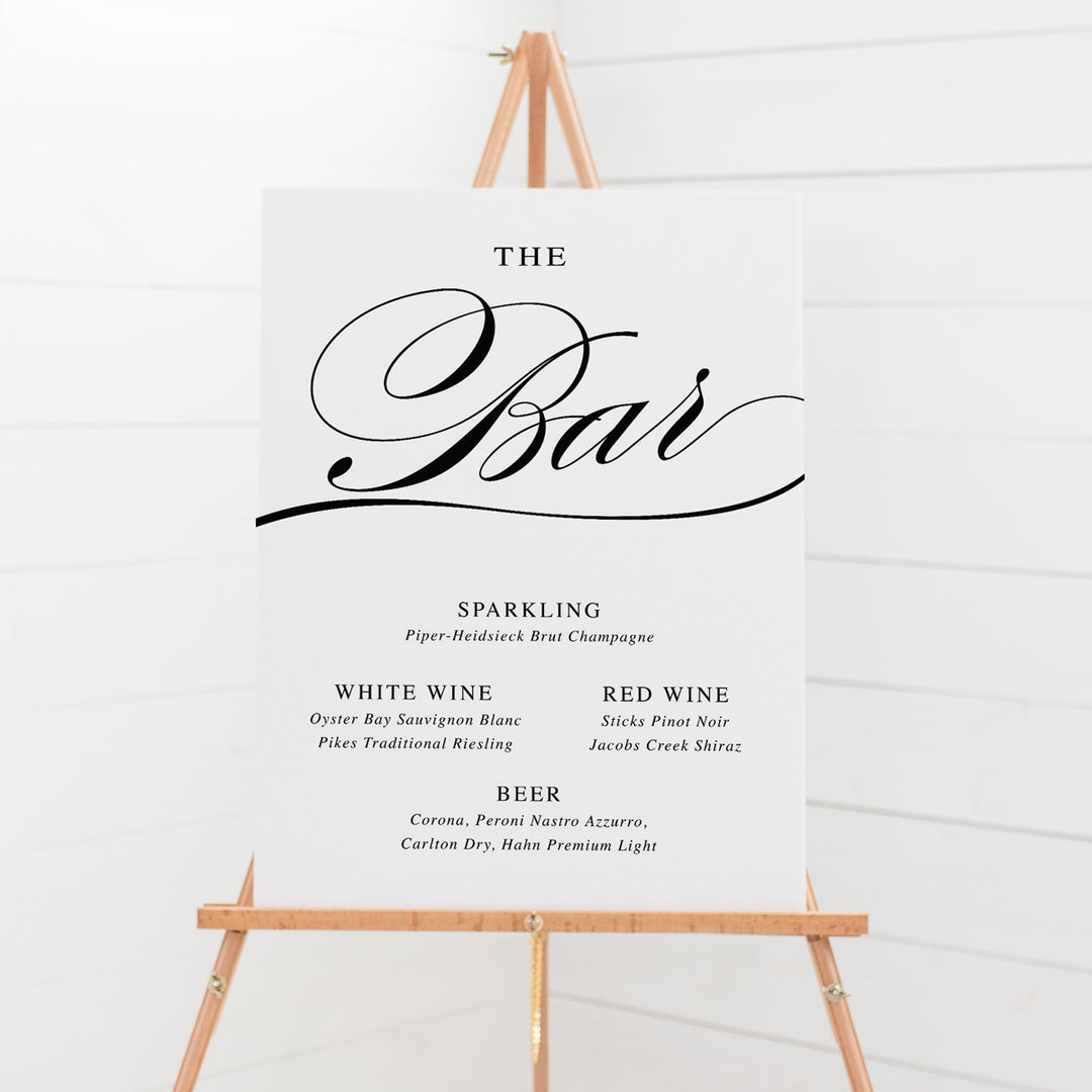 Wedding drinks or beverages signboard with calligraphy font in black, The Bar heading..