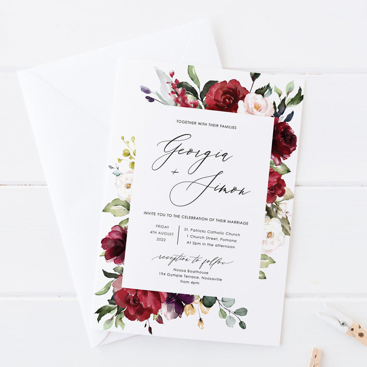 Wedding invitation, red florals and foliage and modern calligraphy font for names