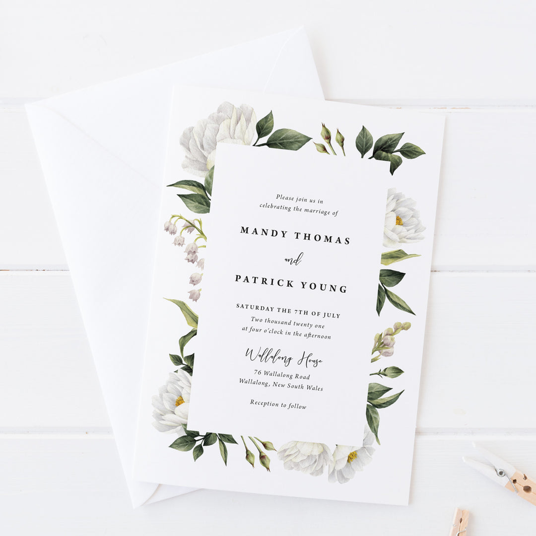 Wedding invitation with beautiful white watercolour flowers and foliage with modern script font