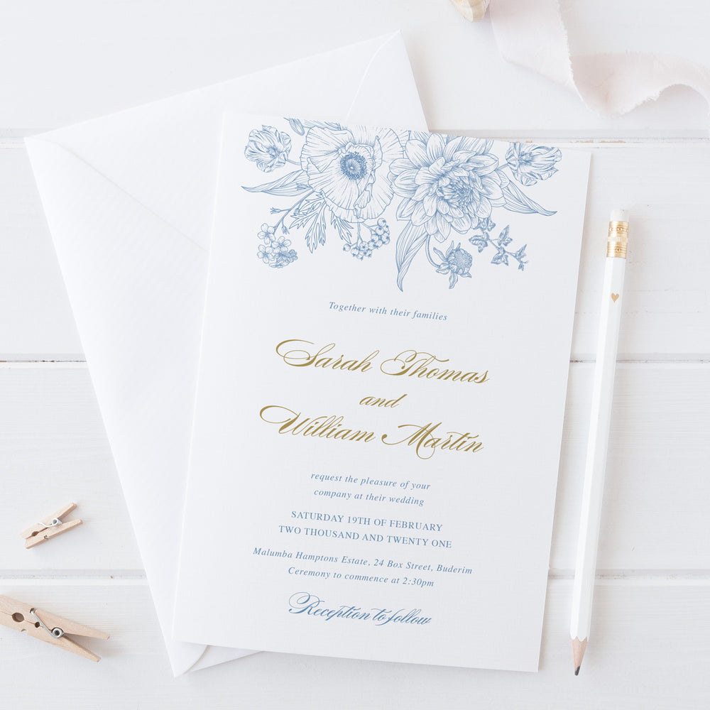 Hamptons style save the date card with cornflower blue detailed floral line art and gold calligraphy
