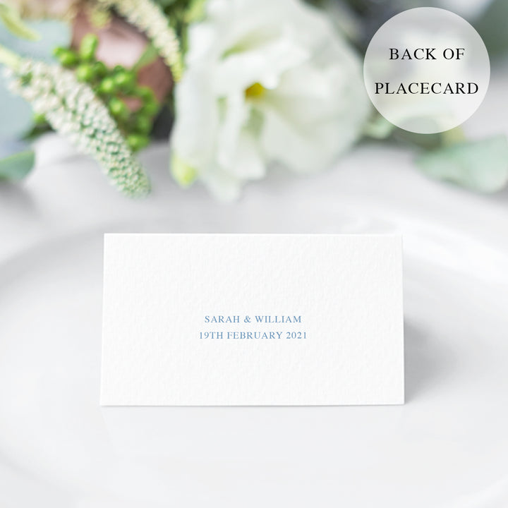 Elegant wedding place cards with delicate, detailed hand drawn floral line art in soft cornflower blue and gold