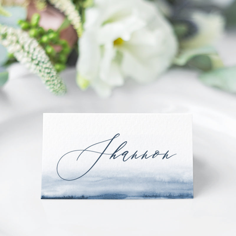 Wedding place card with navy blue watercolour wash and calligraphy font style