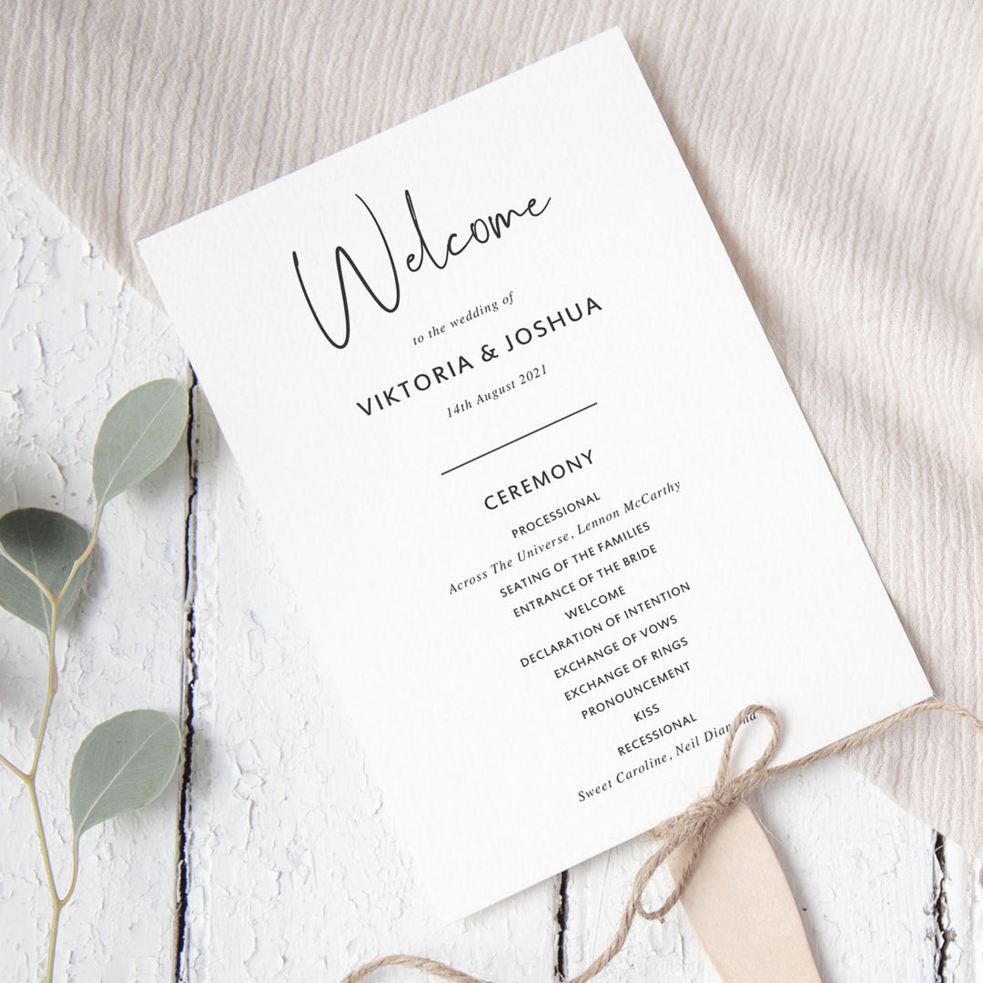 Minimal wedding ceremony program in charcoal and white with script font