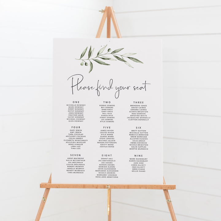 Rustic wedding seating chart with large watercolour olive branch and modern script font in charcoal