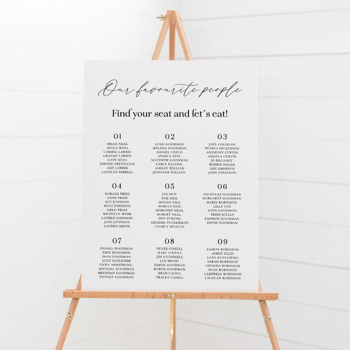Modern wedding seating chart with calligraphy and bold fonts in black and white. Peach Perfect Australia.