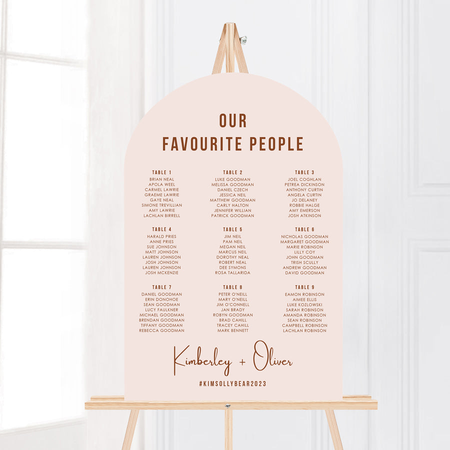 Arch wedding seating chart or seating plan in seedling blush nude pink and terracotta. Printed on foamboard or acrylic for displaying on an easel. Peach Perfect Australia.