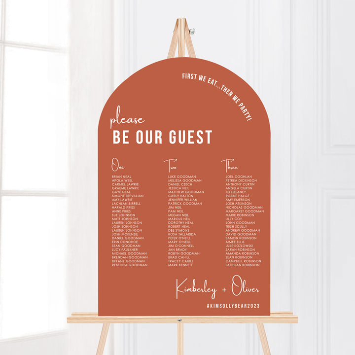 Arch wedding seating chart or seating plan in bright terracotta and white. Printed on foamboard or acrylic for displaying on an easel. Peach Perfect Australia.