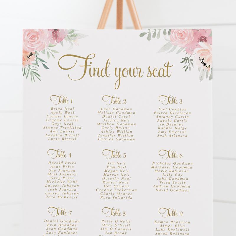 Wedding seating chart with gold text and soft pink flowers and leaves