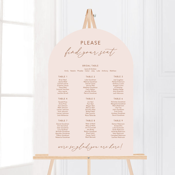 Arch wedding seating chart in boho style in neutral terracotta and blush pink colours. Please find your seat. Peach Perfect Australia.