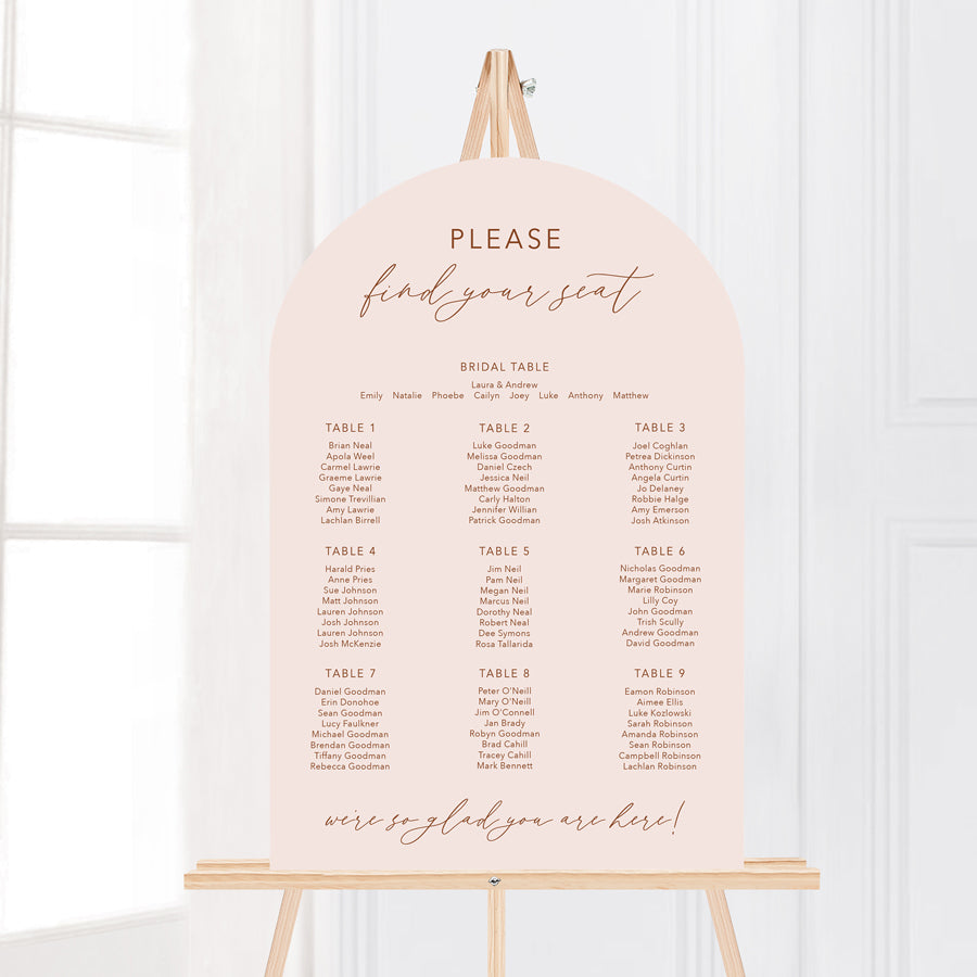 Arch wedding seating chart in boho style in neutral terracotta and blush pink colours. Please find your seat. Peach Perfect Australia.