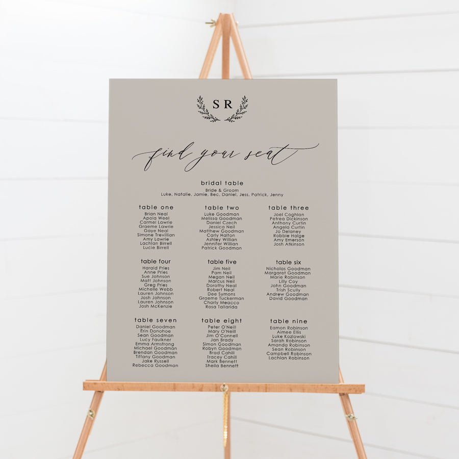Wedding seating chart with monogram of bride and grooms initials and calligraphy font. Printed on pvc foam board or acrylic.