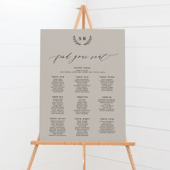 Wedding seating chart with monogram of bride and grooms initials and calligraphy font. Printed on pvc foam board or acrylic.