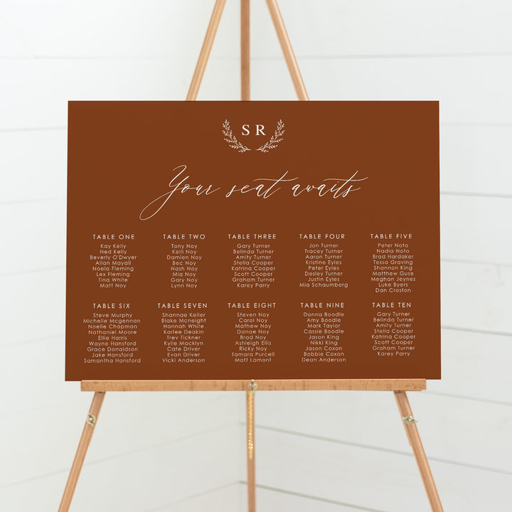 Wedding seating chart with monogram of bride and grooms initials and calligraphy font. Printed on pvc foam board or acrylic.