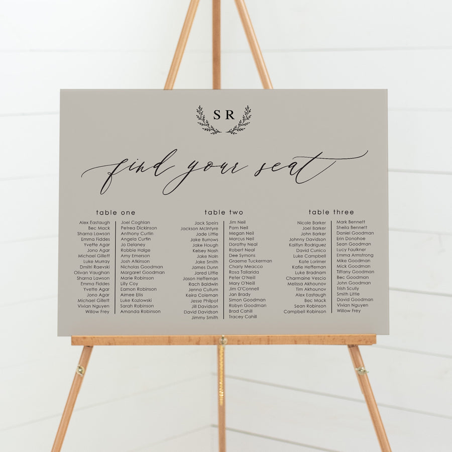 Wedding seating chart with monogram of bride and grooms initials and calligraphy font. Banquet style layout on pvc foamboard or acrylic. 