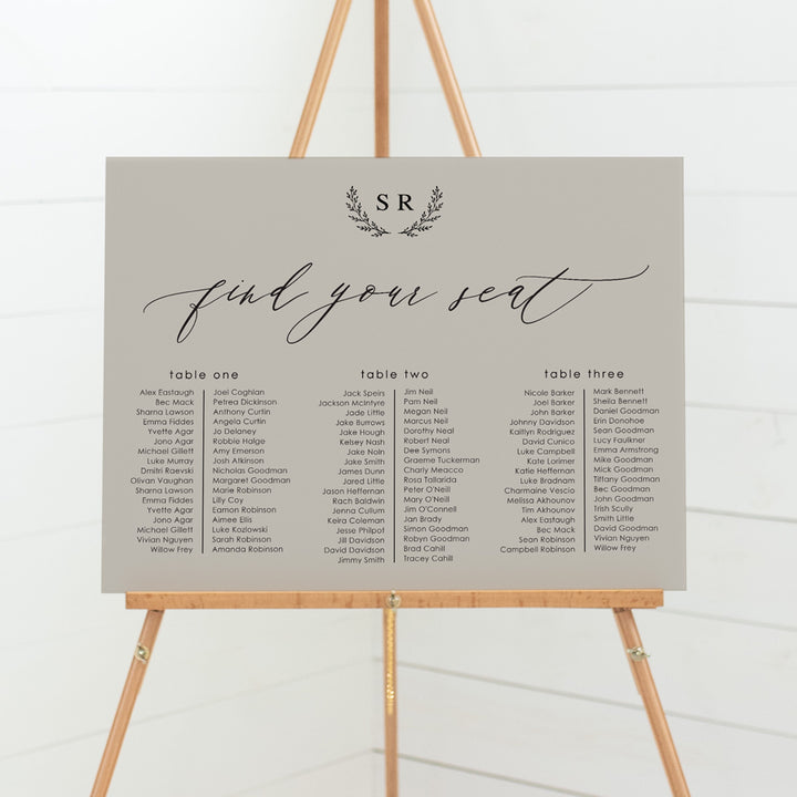 Wedding seating chart with monogram of bride and grooms initials and calligraphy font. Banquet style layout on pvc foamboard or acrylic. 